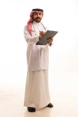 Saudi Male Doctor with Stethoscope Writing on Clipboard