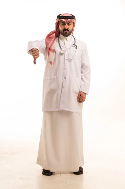 Saudi Doctor with Thumbs Down Gesture on White Background