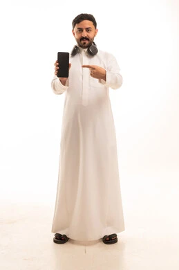 Saudi Man in Thobe Holding Smartphone with Headphones
