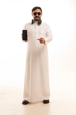Saudi Man in Thobe Holding Smartphone on White Background