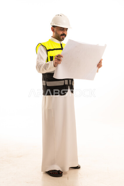 Saudi Engineer with Blueprint and Safety Gear