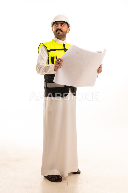 Saudi Engineer Holding Blueprints in Safety Gear