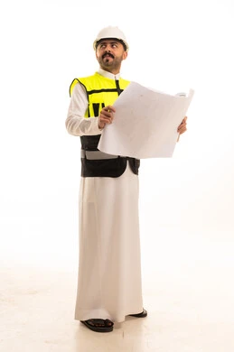 Saudi Engineer Holding Blueprints in Safety Gear