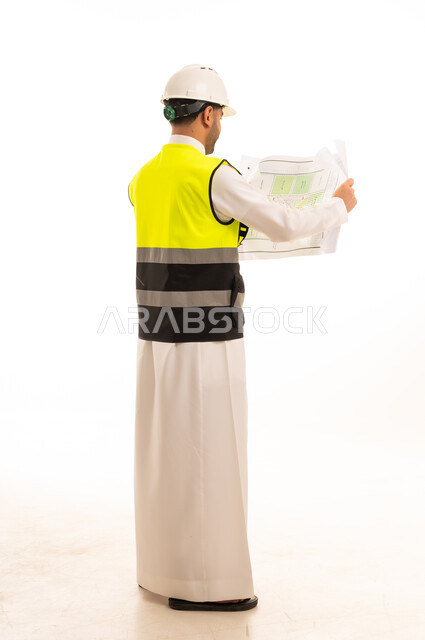 Saudi Engineer with Blueprint and Safety Gear