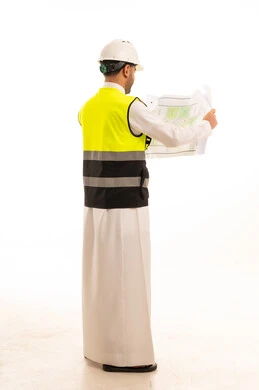 Saudi Engineer with Blueprint and Safety Gear