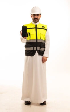 Saudi Engineer in Thobe Holding Smartphone