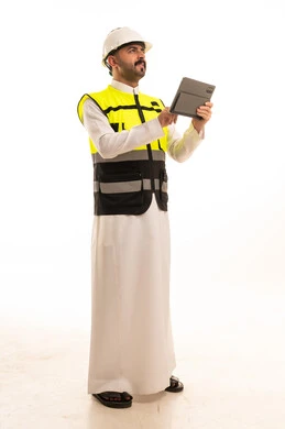 Saudi Engineer in Safety Vest Holding Digital Tablet