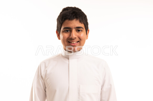 Smiling Saudi Boy in Traditional White Thobe