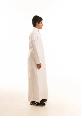 Saudi Boy in Traditional White Thobe Side Profile View