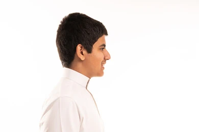 Young Saudi Man in Profile Wearing White Thobe