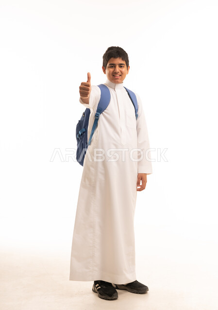Saudi Student in White Thobe Giving Thumbs Up