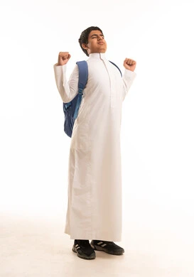 Saudi Boy in White Thobe with Backpack Stretching