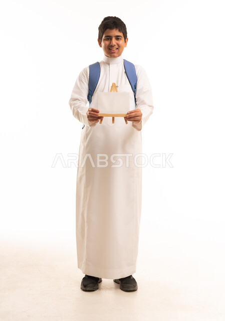 Saudi Student Boy in White Thobe Holding Blank Easel