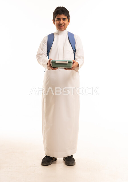 Saudi Boy in Traditional Thobe with School Lunch Box