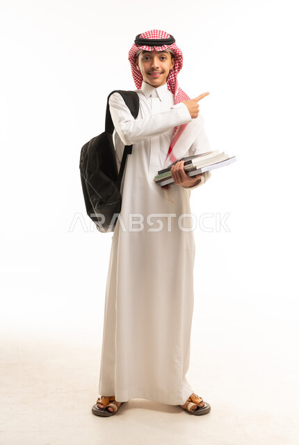 Saudi Male Student Pointing Holding School Books