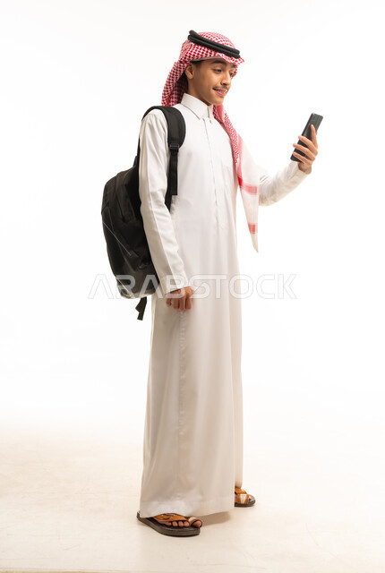 Saudi Student with Smartphone and Backpack