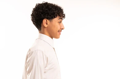 Young Saudi Man in Traditional White Thobe Profile View