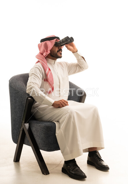 Saudi Man with Binoculars in Traditional Thobe Studio Shot