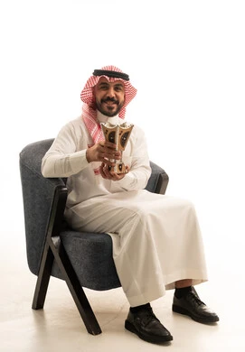 Saudi Man Holding Traditional Incense Burner on White Background