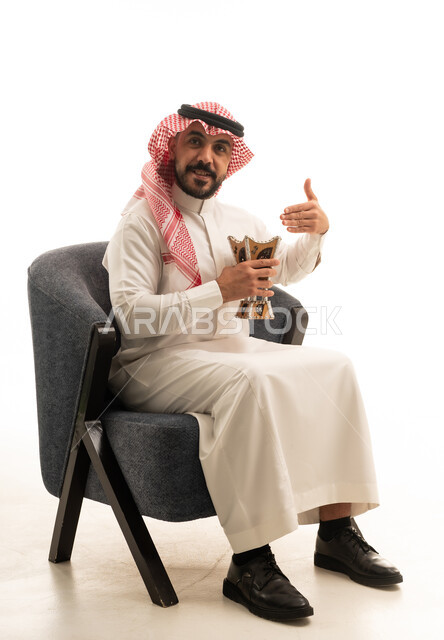 Saudi Man with Traditional Incense Burner Thobe
