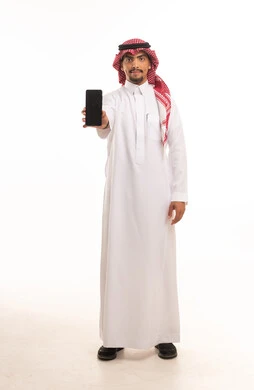 Saudi Man in Thobe Holding Smartphone White Background