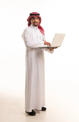Saudi Man in Traditional Thobe Holding Laptop