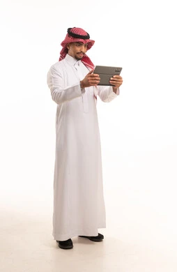 Saudi Man in White Thobe Using Digital Tablet Studio Shot