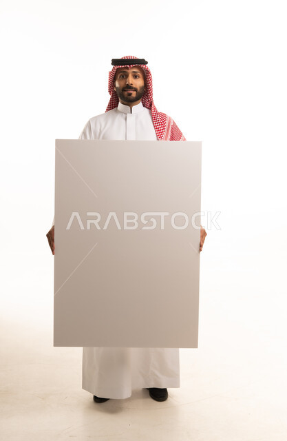 Saudi Man Holding Blank White Board in Studio