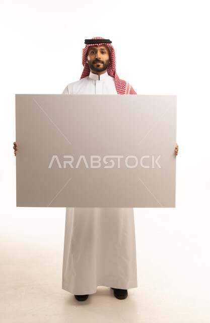 Saudi Man Holding Blank White Board in Studio