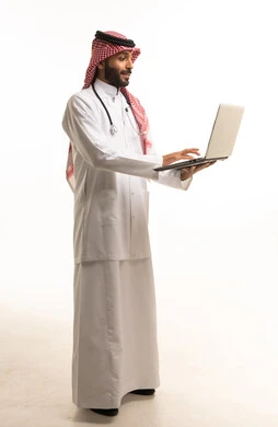 Saudi Male Doctor with Laptop and Stethoscope on White