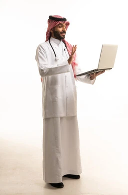 Saudi Male Doctor Holding Laptop in White Studio