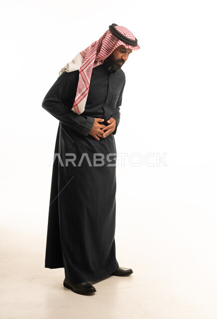 Saudi Man in Traditional Thobe with Stomach Pain