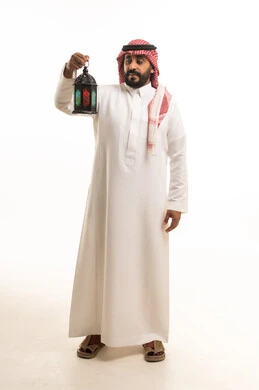 Saudi Man Holding Ramadan Lantern in Traditional Thobe