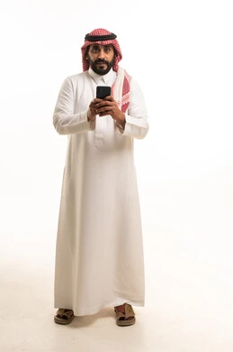 Saudi Man in Traditional Thobe Holding Smartphone