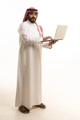 Saudi Man in Traditional Thobe Holding Laptop
