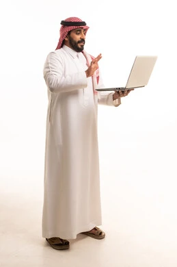 Saudi Man in Traditional Thobe Using Laptop on White