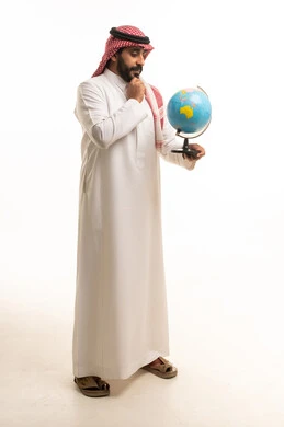 Saudi Man in Thobe Holding World Globe
