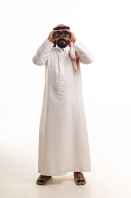 Saudi Man in Traditional Thobe Looking Through Binoculars