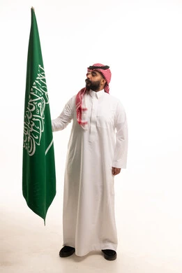 Saudi Man Holding National Flag on White Background