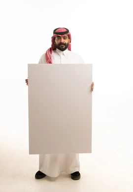 Saudi Man in Traditional Dress Holding Blank Board
