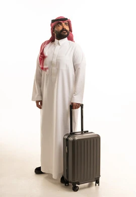 Saudi Man with Suitcase on White Background