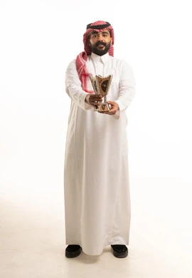 Saudi Man in Traditional Clothing Holding Incense Burner