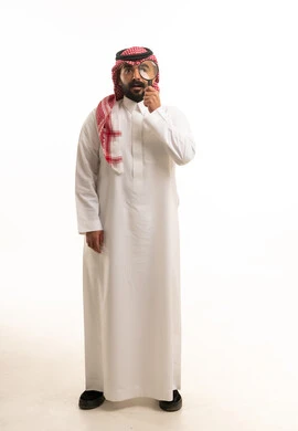 Saudi Man in Thobe with Magnifying Glass