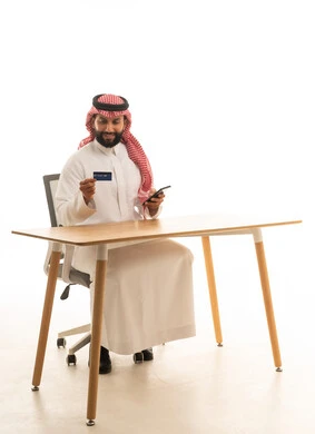 Saudi Man with Credit Card and Smartphone on White Background