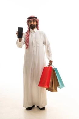 Saudi Man with Smartphone and Shopping Bags