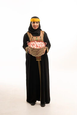 Saudi Woman with Taif Roses in Traditional Dress
