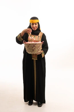 Saudi Woman in Traditional Dress with Taif Roses