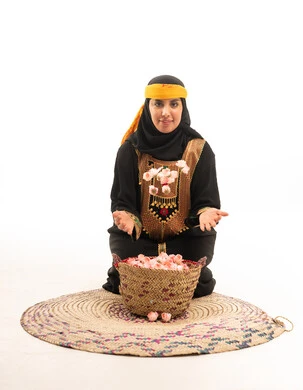 Emirati Woman in Traditional Dress with Roses