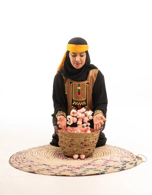 Saudi Woman in Traditional Dress with Taif Roses