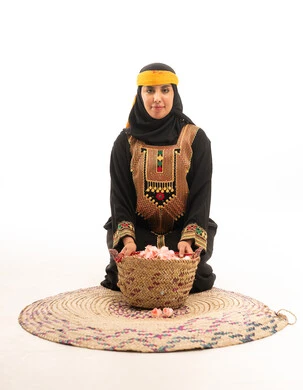 Saudi Woman in Traditional Asir Dress with Roses